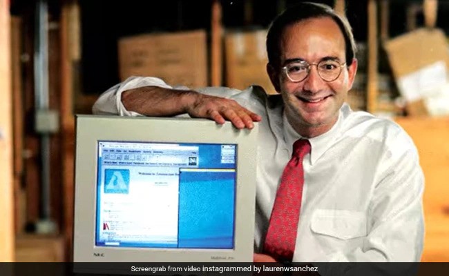 Jeff Bezos with a computer monitor